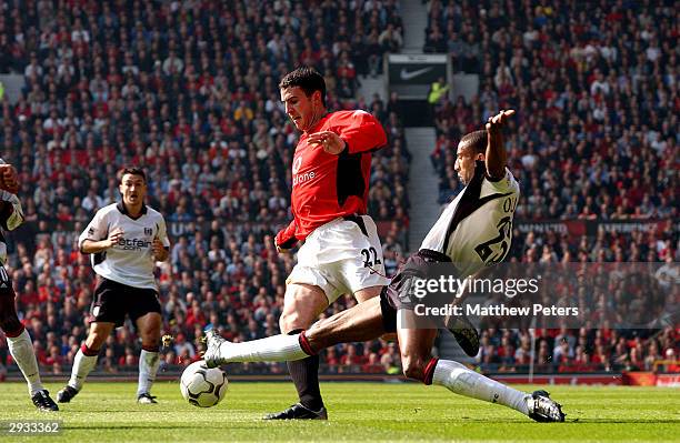 John O'Shea is tackled by Fulham's Abdeslam Ouaddou during the FA Barclaycard Premiership match between Manchester United v Fulham at Old Trafford on...