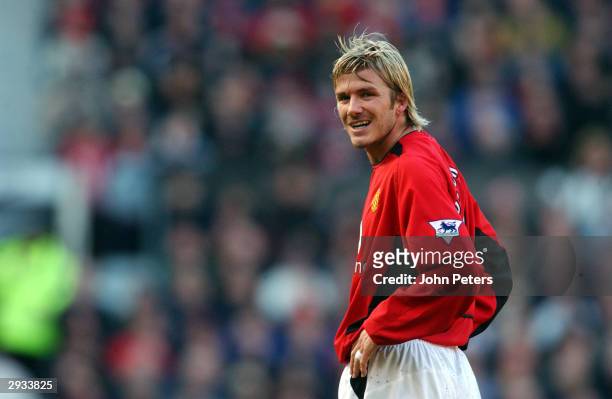 David Beckham smiles at the camera after his free kick hits the woodwork during the FA Cup Fourth Round match between Manchester United v Portsmouth...