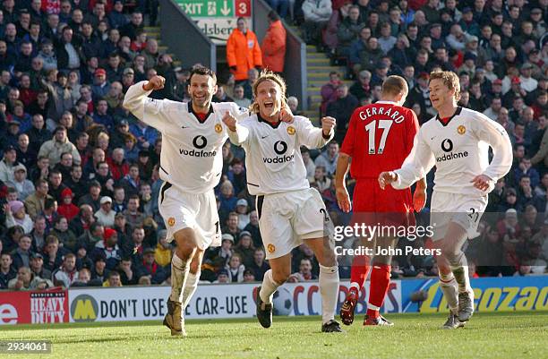 Diego Forlan celebrates his second goal of the match with Ryan Giggs and Ole Gunnar Solkjaer during the FA Barclaycard Premiership match between...