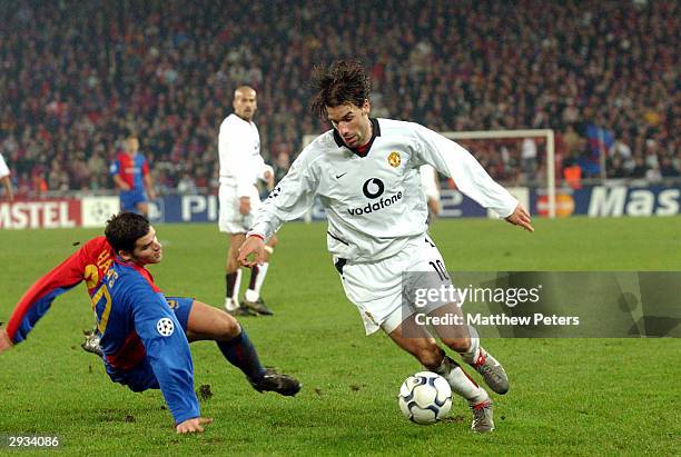 Ruud Van Nistelrooy runs the ball past the Basel defence on his way to scoring his second goal during the UEFA Champions League Group D match between...