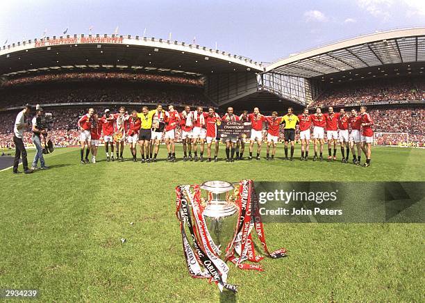 The Manchester United team celebrate on the pitch after the FA Premiership match between Manchester United v Tottenham Hotspur at Old Trafford on May...