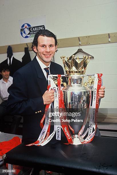 Ryan Giggs of Manchester United celebrates in the dressing room with the FA Premiership Trophy after the Middlesbrough v Manchester United FA...