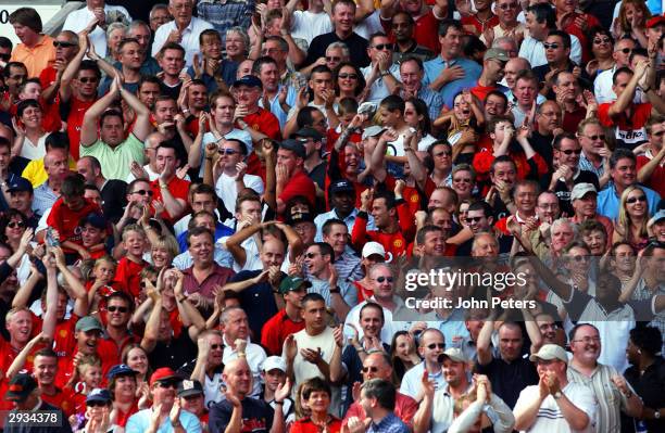 Manchester United Fans celebrate after Ole Gunnar Solskjaer scores during the match between Manchester United v West Bromwich Albion at Old Trafford...