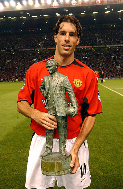 Ruud van Nistelrooy with the Sir Matt Busby Player of the year award 2001- 2002 presented to him before the FA Barclaycard Premiership match between...
