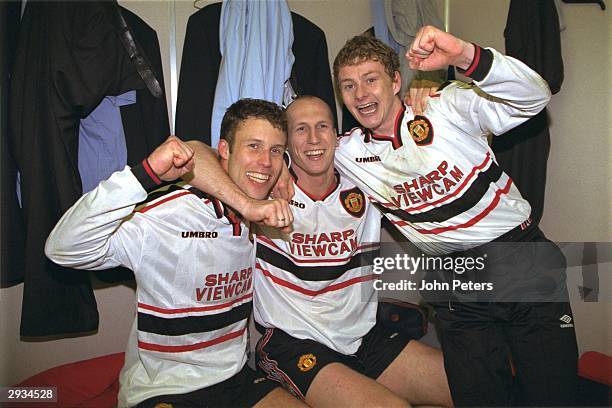 Jaap Stam, Ole Gunnar Solskjaer and Ronny Johnson of Manchester United celebrate in the dressing room after the FA Cup semi-final between Arsenal v...