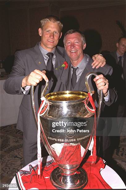 Sir Alex Ferguson and Peter Schmeichel with the European Cup at the post match party after the UEFA Champions League Final between Bayern Munich v...