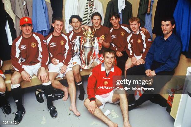 Eric Cantona, Nicky Butt, Ryan Giggs, David Beckham, Gary Neville, Paul Scholes, Roy Keane and Phil Neville of Manchester United celebrate in the...