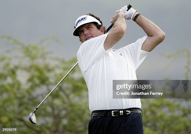 Bruce Lietzke hits a shot during the first round of the Champions Tour Mastercard Championship on January 23, 2004 at the Hualalai Golf Club in...