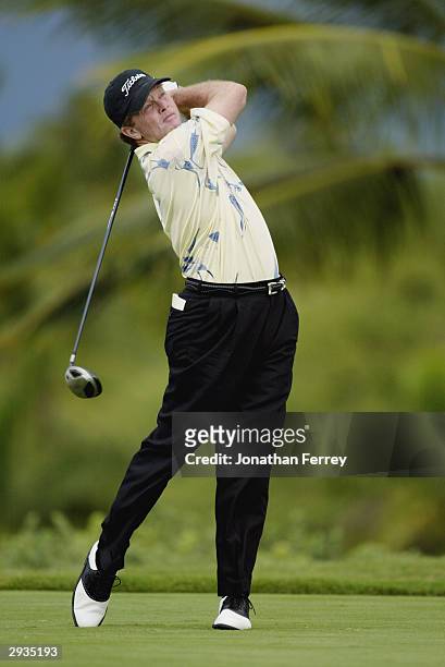Tom Kite hits a shot during the first round of the Champions Tour Mastercard Championship on January 23, 2004 at the Hualalai Golf Club in...