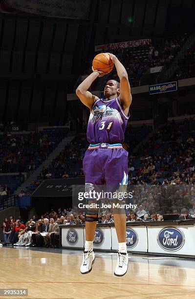 Jarron Collins of the Utah Jazz takes an open jump shot during the game against the Memphis Grizzlies at the Pyramid Arena on January 30, 2004 in...