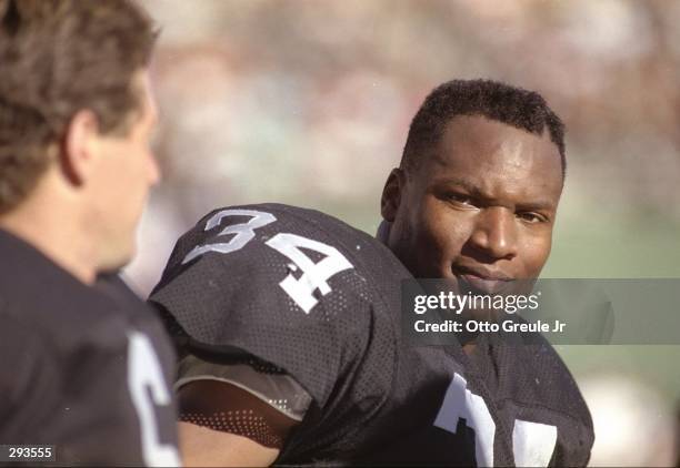 Running back Bo Jackson of the Los Angeles Raiders looks on during a game against the San Diego Chargers at the Los Angeles Memorial Coliseum in Los...