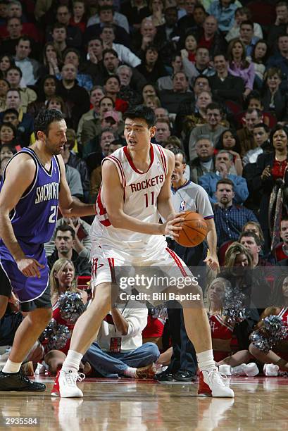 Yao Ming of the Houston Rockets posts up Vlade Divac of the Sacramento Kings during the game at the Toyota Center in Houston, Texas on January 28,...