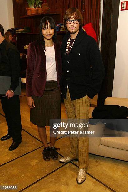 Models Federico Galavis and Mekeda Smith attend the Original Penguin store opening February 05, 2004 in New York City.