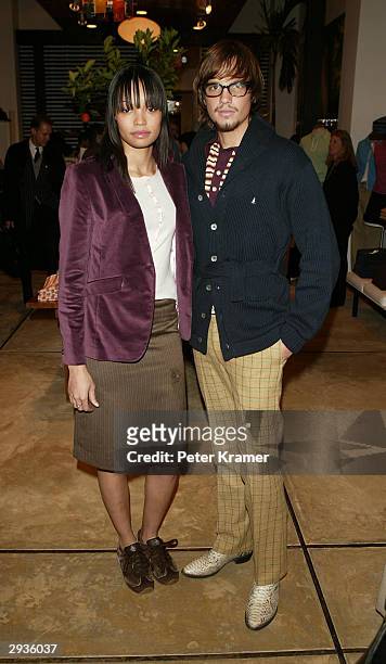 Models Federico Galavis and Mekeda Smith attend the Original Penguin store opening February 05, 2004 in New York City.