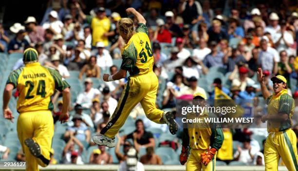 Australian paceman Brett Lee celebrates dismissing Indian batsman Youraj Singh with teammates Brad Williams , Adam Gilchrist and Matthew Hayden...