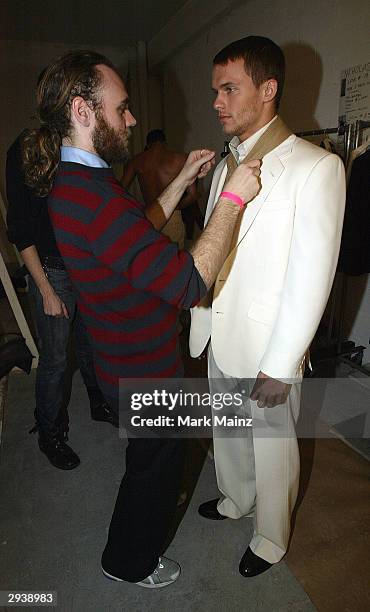 Fashion designer Frazer Harmon prepares for the runway backstage during the Harmon Fall 2004 fashion show at MAO/Atlas during the Olympus 2004...