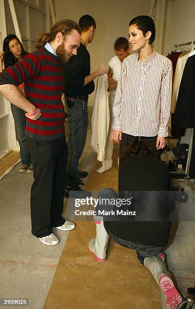 Fashion designer Frazer Harmon prepares for the runway backstage during the Harmon Fall 2004 fashion show at MAO/Atlas during the Olympus 2004...
