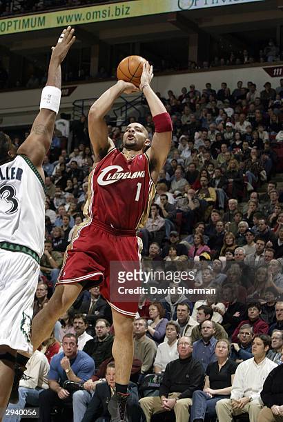 Carlos Boozer of the Cleveland Cavaliers puts the jump shot up over Oliver Miller of the Minnesota Timberwolves on February 6, 2004 at the Target...