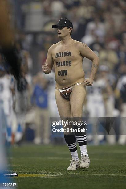 Streaker walks across the field during Super Bowl XXXVIII between the New England Patriots and the Carolina Panthers at Reliant Stadium on February...