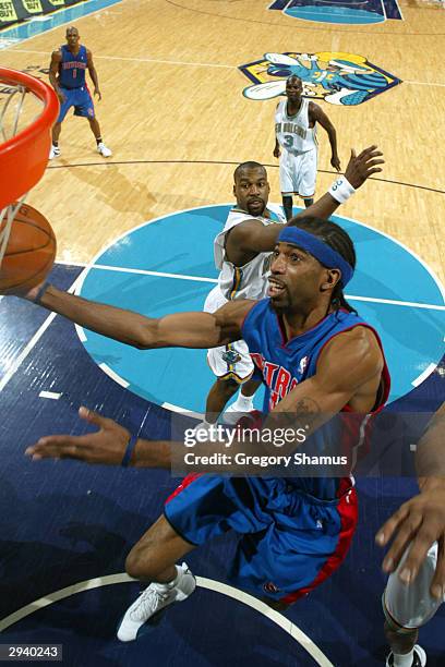 Richard Hamilton of the Detroit Pistons gets to the basket past Baron Davis of the New Orleans Hornets February 6, 2004 in New Orleans, Louisiana....