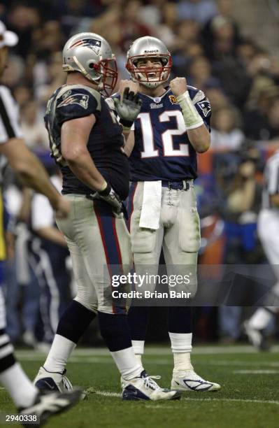 Quarterback Tom Brady of the New England Patriots celebrates during Super Bowl XXXVIII against the Carolina Panthers at Reliant Stadium on February...