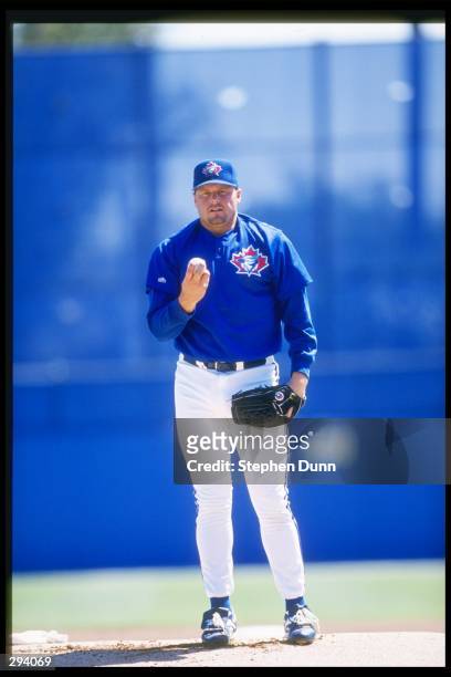 Pitcher Roger Clemens of the Toronto Blue Jays stands on the mound during a preseason game against the Cincinnati Reds at Dunedin Stadium in Dunedin,...