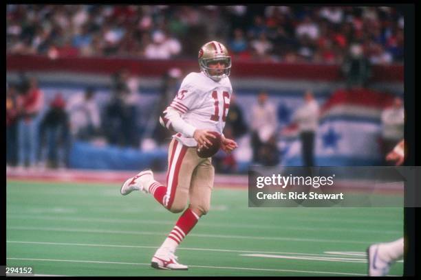 Quarterback Joe Montana of the San Francisco 49ers moves the ball during the the Super Bowl XXIV against the Denver Broncos at the Louisiana...