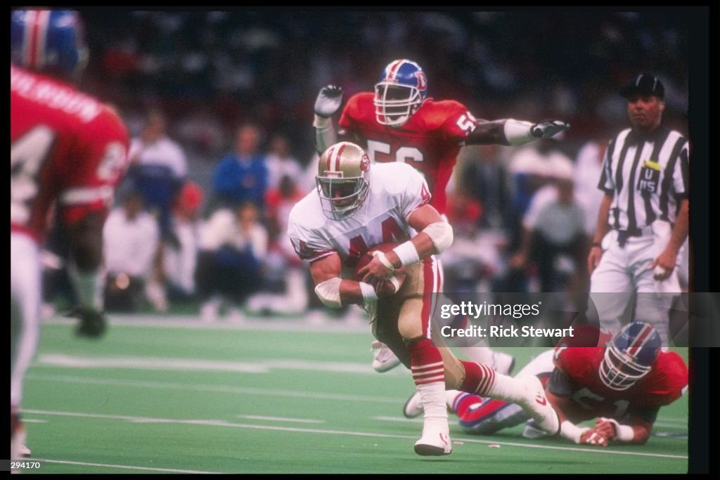 Running back Tom Rathman of the San Francisco 49ers moves away from ...