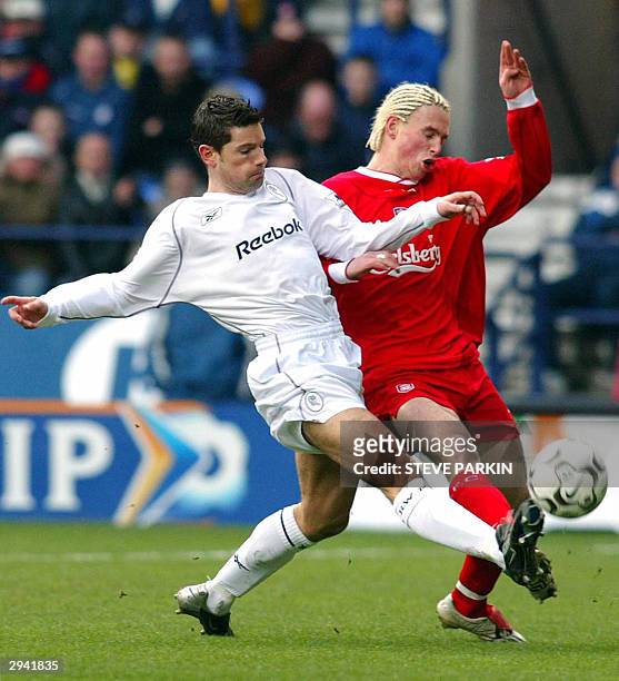 Bolton's Anthony Barnes fights for the ball with Liverpool's Anthony Lellec, 07 February 2004 in Bolton, during their Barclaycard Premier League...