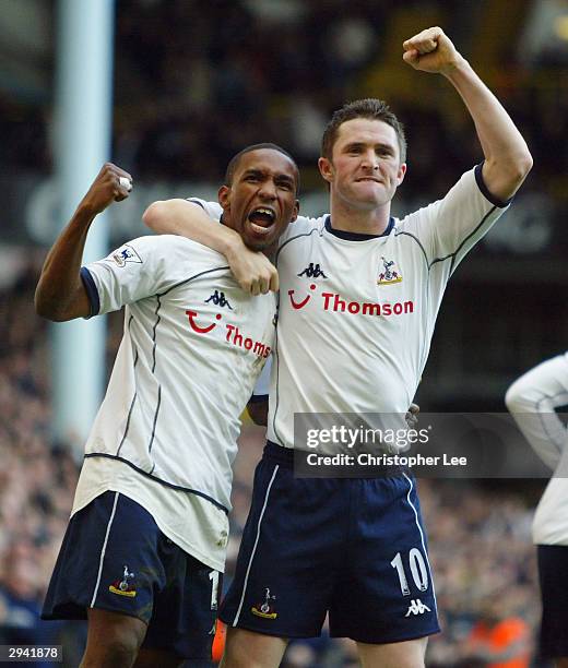 Jermaine Defoe of Tottenham Hotspur celebrates scoring his debut goal with team mate Robbie Keane during the FA Barclaycard Premiership match between...