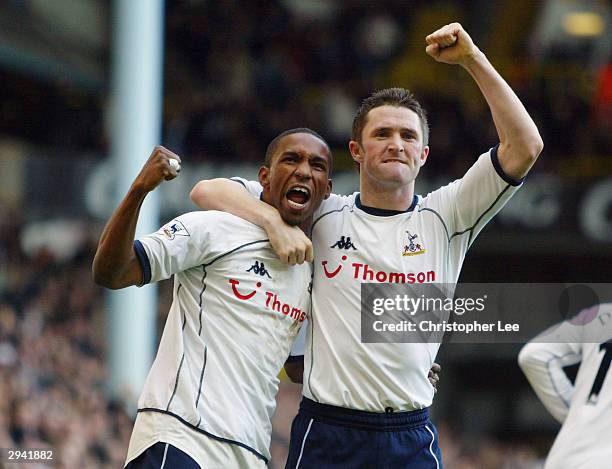 Jermaine Defoe of Tottenham Hotspur celebrates scoring his debut goal with team mate Robbie Keane during the FA Barclaycard Premiership match between...