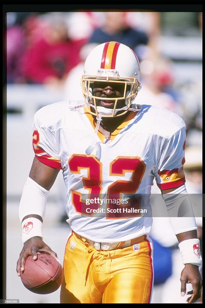 Ericht Rhett Running back Errict Rhett of the Tampa Bay Buccaneers looks on during ...