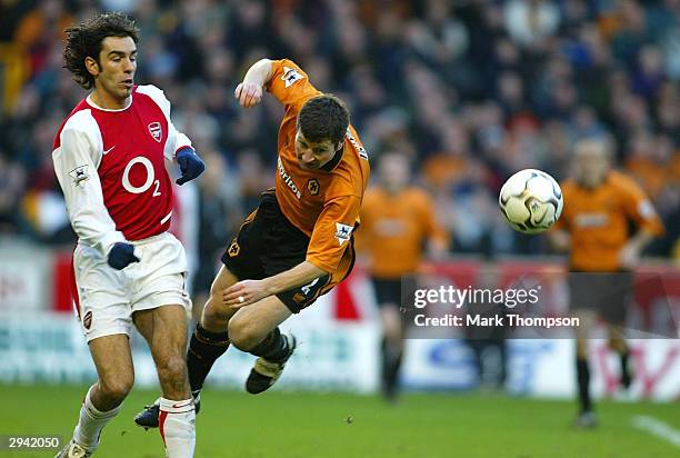 Denis Irwin of Wolves is tackled off his feet by Robert Pires during the FA Barclaycard Premiership match between Wolverhampton Wanderers and Arsenal...