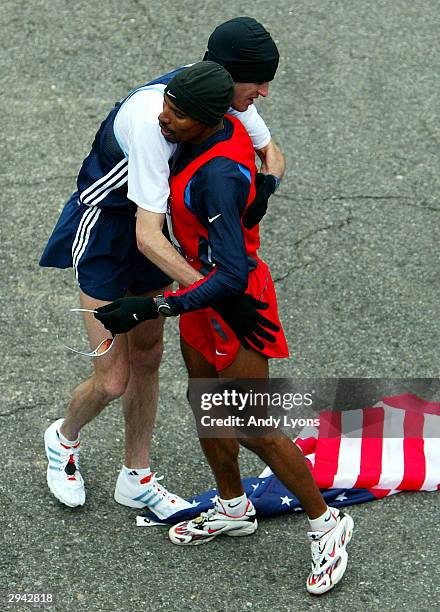 Meb Keflezighi and Alan Culpepper share a hug after finishing the U.S. Olympic Marathon Trials on February 7, 2004 in Birmingham, Alabama. Culpepper...