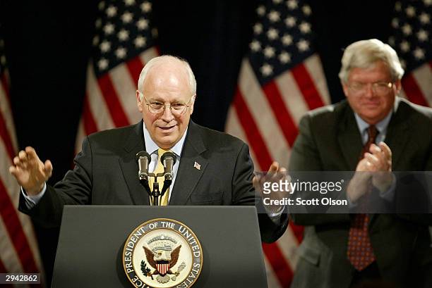 Vice President Dick Cheney receives applause from Speaker of the House Dennis Hastert during a speech delivered at a fundraiser for Hastert hosted by...