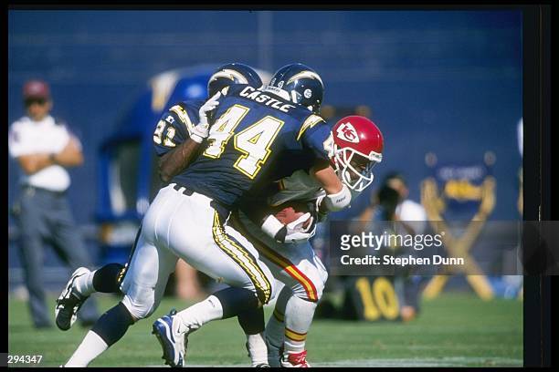 Defensive back Eric Castle of the San Diego Chargers joins in a tackle during a game against the Kansas City Chiefs at Jack Murphy Stadium in San...