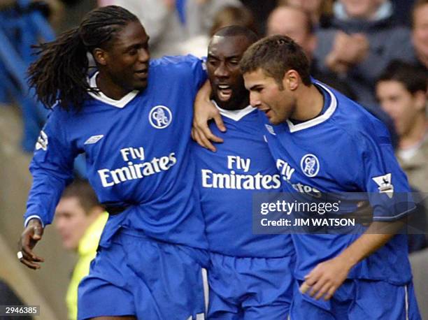 Chelsea's Jimmy Flyod Hasselbaink celebrates with teammates Adrain Mutu and Mario Melchiot after scoring with a penalty kick against Charlton...