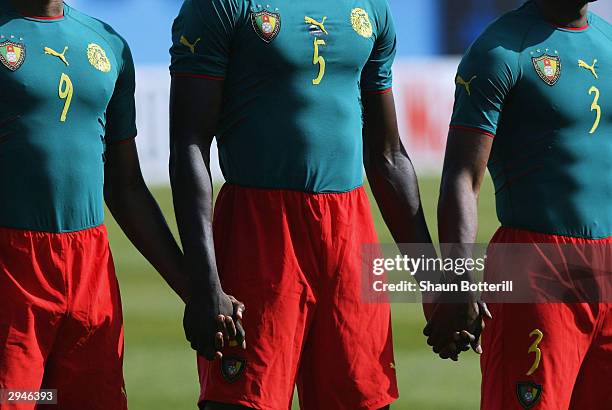 The Cameroon team line-up in their one peace kit before the African Nations Cup 2004 1/4 Final match between Cameroon and Nigeria at the Mustapha Ben...