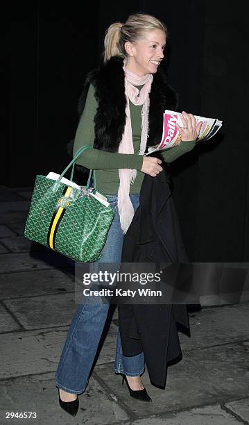 Vogue Magazine editor Meredith Melling Burke wears a Goyard Handbag during Olympus Fashion Week at Bryant Park, February 8, 2004 in New York City.