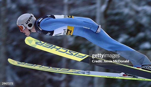 Jan Mazoch of Czech Republic is one of the few to make a jump as bad snow storms cancel the FIS Ski Jumping World Cup on February 8, 2004 in...