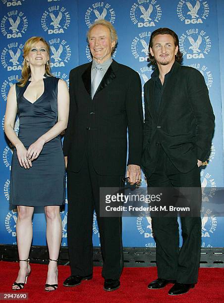 Actress Laura Linney poses with actor's and director's Clint Eastwood and Sean Penn backstage at the 56th Annual DGA Awards at the Century Plaza...