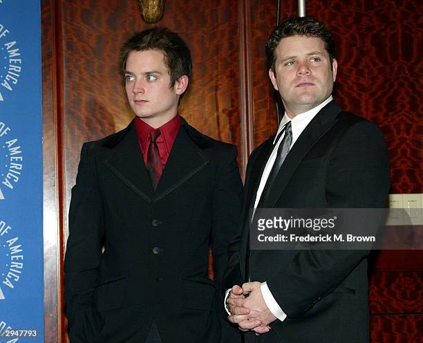 Actors Elijah Wood and Sean Astin pose backstage at the 56th Annual DGA Awards at the Century Plaza Hotel on February 7, 2004 in Beverly Hills,...