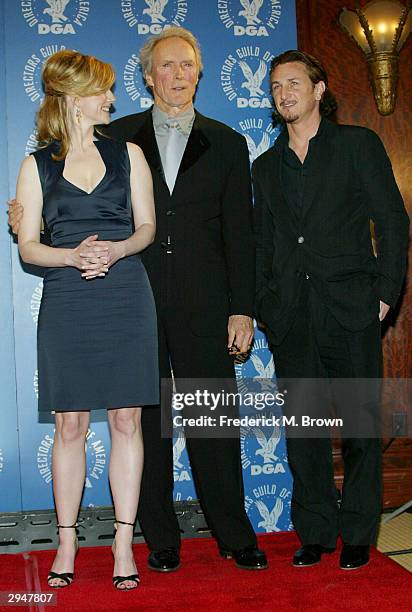 Actress Laura Linney poses with actor's and director's Clint Eastwood and Sean Penn backstage at the 56th Annual DGA Awards at the Century Plaza...