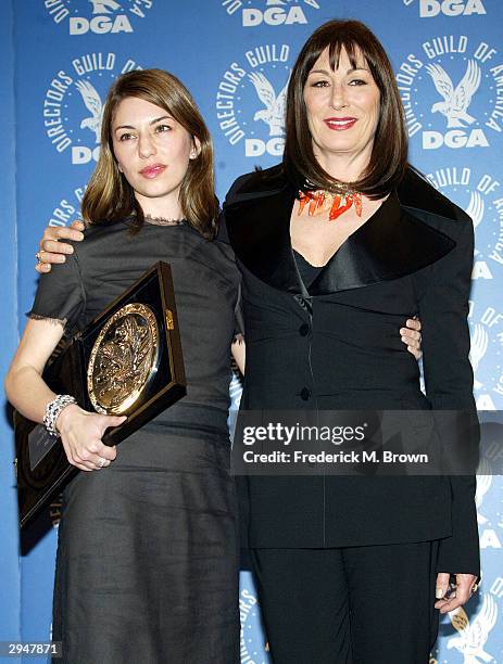 Director Sofia Coppola and actress Anjelica Huston pose backstage with Coppola's nomination plaque at the 56th Annual DGA Awards at the Century Plaza...