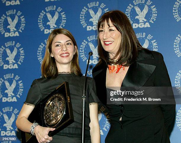 Director Sofia Coppola and actress Anjelica Huston pose backstage with Coppola's nomination plaque at the 56th Annual DGA Awards at the Century Plaza...