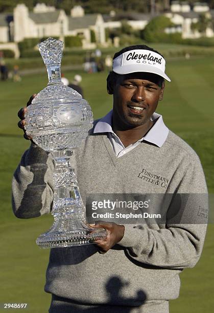 Vijay Singh holds the trophy following the final round of the AT&T Pebble Beach National Pro-Am at Pebble Beach Golf Links on February 8, 2003 in...