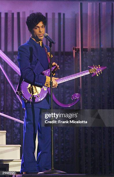 Grammy and Oscar-winning recording artist Prince performs the song "Purple Rain" at the 46th Annual Grammy Awards held at the Staples Center on...