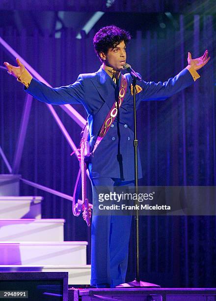 Grammy and Oscar-winning recording artist Prince performs the song "Purple Rain" at the 46th Annual Grammy Awards held at the Staples Center on...
