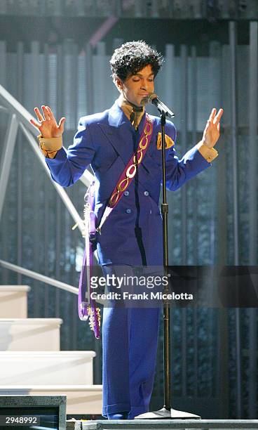 Grammy and Oscar-winning recording artist Prince performs the song "Purple Rain" at the 46th Annual Grammy Awards held at the Staples Center on...