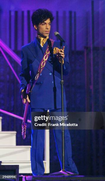 Grammy and Oscar-winning recording artist Prince performs the song "Purple Rain" at the 46th Annual Grammy Awards held at the Staples Center on...